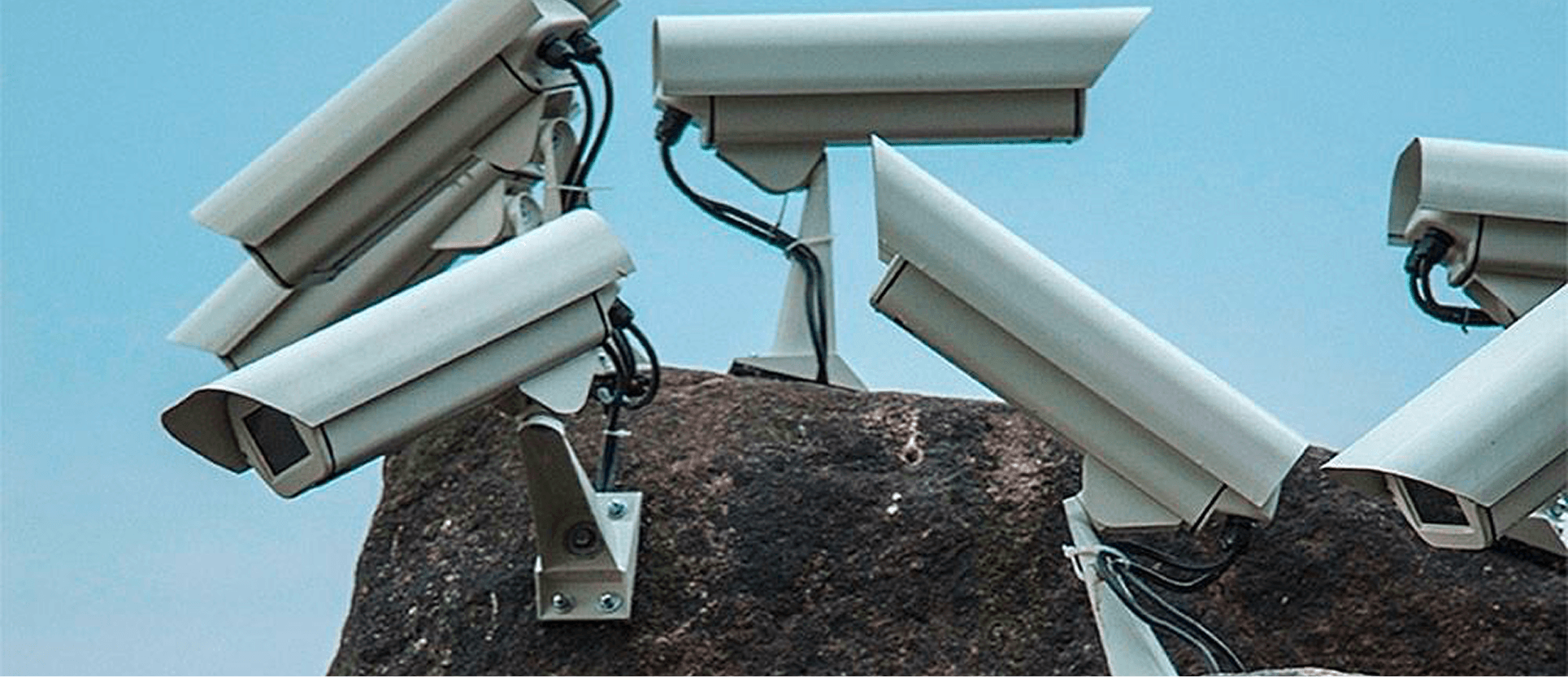 A cluster of security cameras pointing in every direction